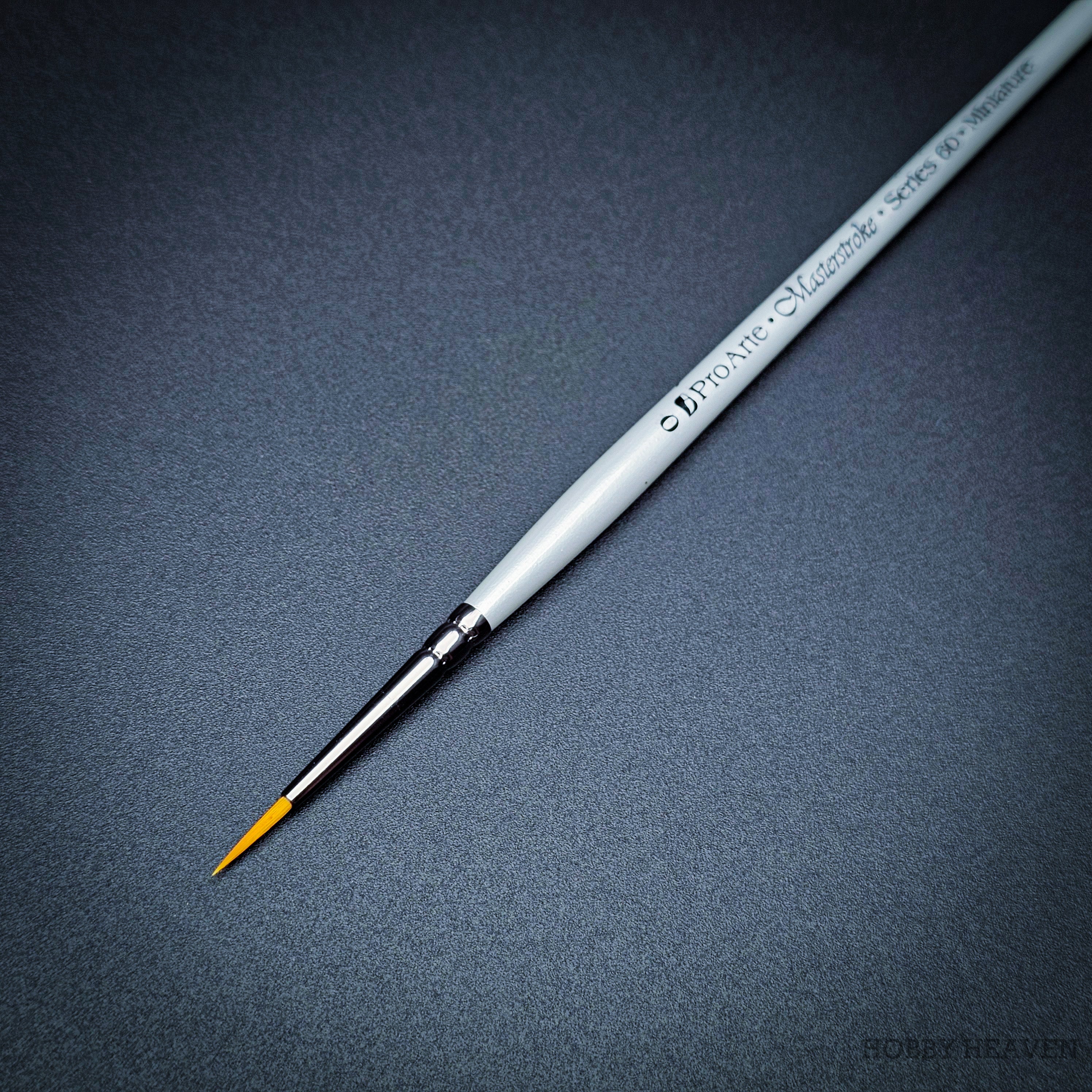 Pro Arte Masterstroke Series 60 – Close-up of size 0 Prolon Round Brush on black background.
