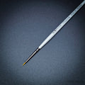 Pro Arte Masterstroke Series 60 – Close-up of size 5/0 Prolon Round Brush on black background.