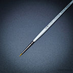 Pro Arte Masterstroke Series 60 – Close-up of size 5/0 Prolon Round Brush on black background.