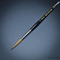 Raphael Kolinsky Sable Brush 88026 – Close-up of size 10, fine detail long tip liner on black background.