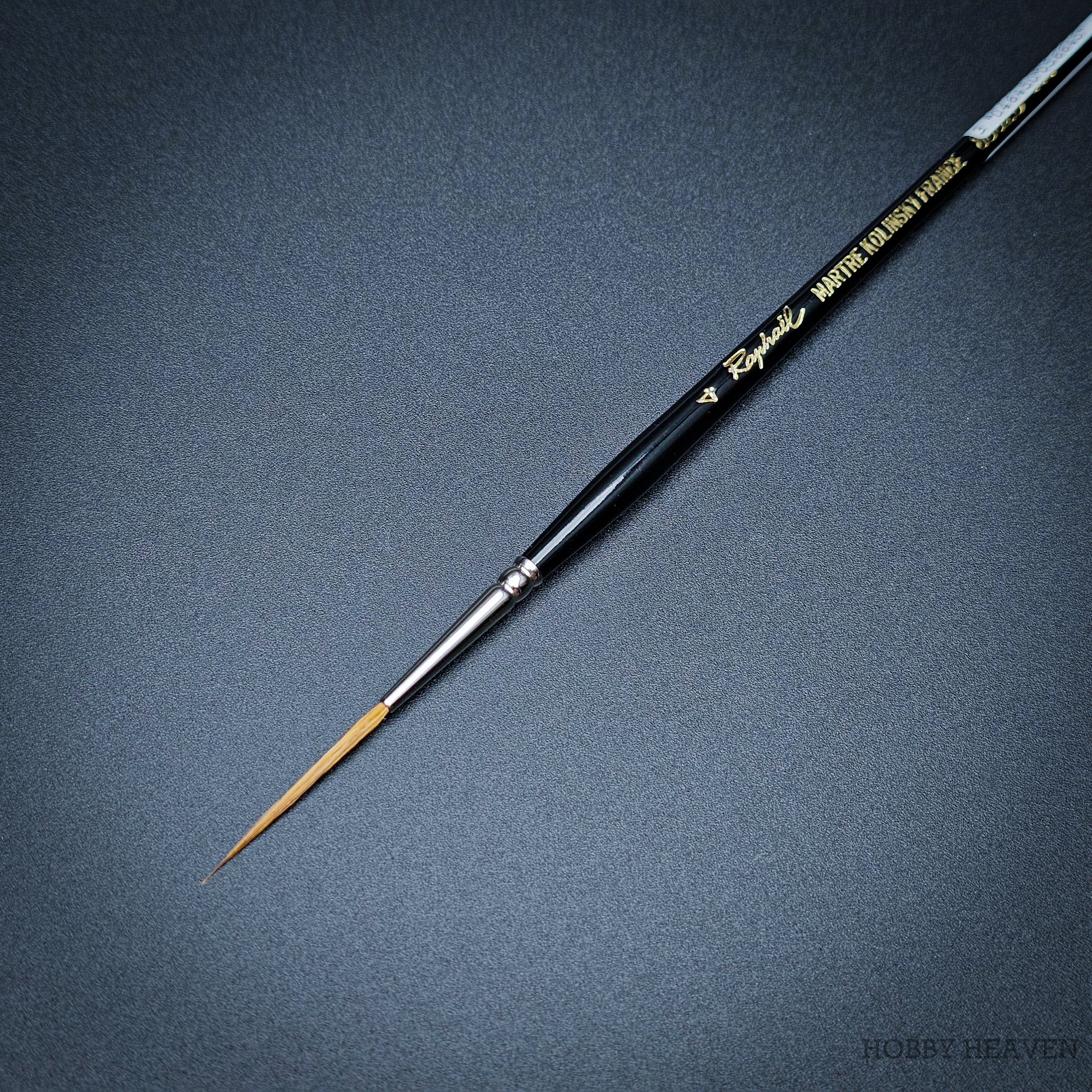 Raphael Kolinsky Sable Brush 88026 – Close-up of size 4, fine detail long tip liner on black background.