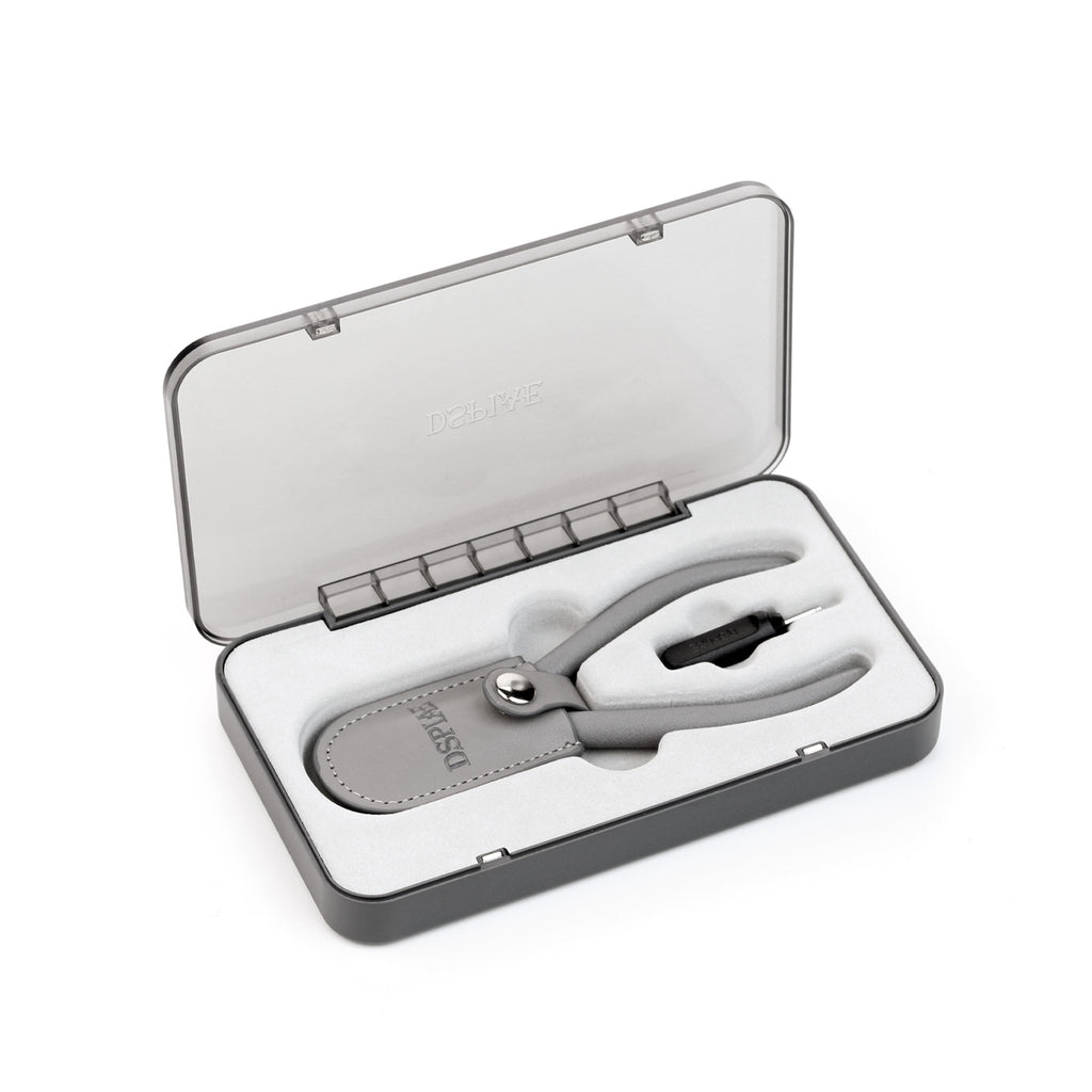 Grey magnetic storage case open, holding the ST-C2 nipper in its leather blade cover