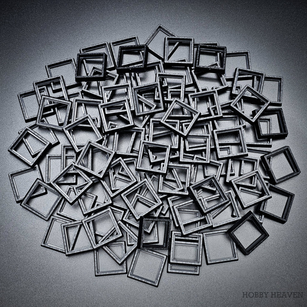 Black square base converters 20mm to 25mm scattered on dark background