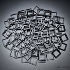 Black square base converters 20mm to 25mm scattered on dark background