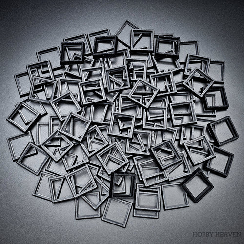 Black square base converters 20mm to 25mm scattered on dark background