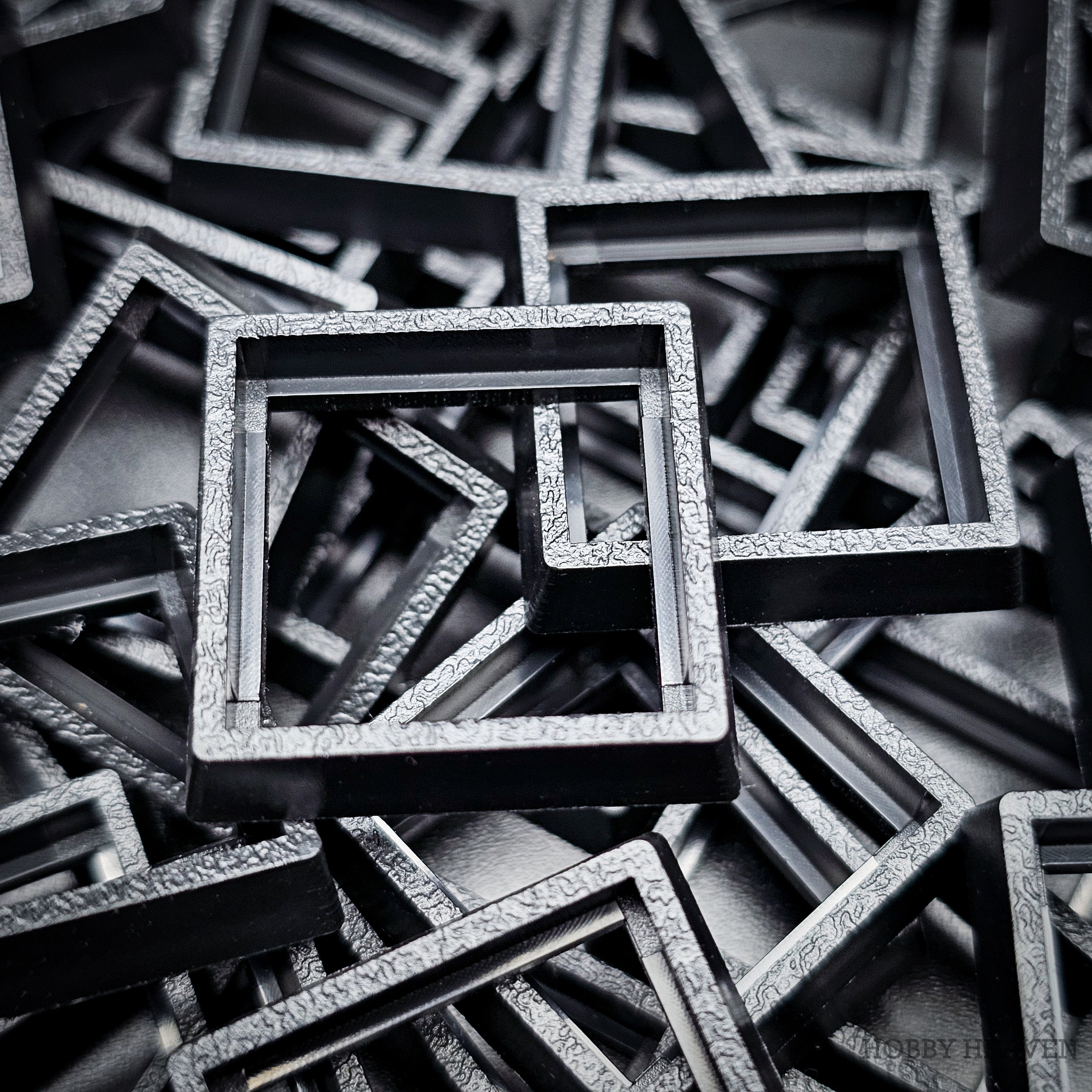  Close-up of injection moulded base converters 20mm to 25mm square size
