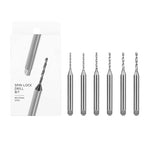 Six DSPIAE XDB-S01 spin-lock drill bits laid out beside the box, each shank engraved with its size from 1.0 to 1.5 mm