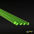 Five fluorescent green acrylic rods, 1.6 mm, lying side by side on a dark background
