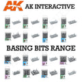 AK Interactive Basing Bits complete range overview showing all product packages including Grass Tufts, Tall Grass, Rocks and Tors, Forest Mushrooms, Dead Tree, Fern, Candles, Barrel Cactus, Village Ruins, Weapon Shot FX, Portal FX, Gigant Mushrooms, and Water Lilies 