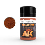 AK043 Medium Rust: 35 ml AK PIGMENTS jar with a black screw cap, beside a swatch of warm reddish-brown powder
