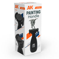 AK Interactive AK9563 Painting Handle retail box showing product with miniature warrior figure mounted, plus two detail images demonstrating 32mm round and 20x20mm square base compatibility

