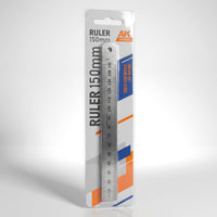 AK Interactive AK9546 Steel Ruler 150mm in retail blister packaging shown at angle with studio lighting highlighting the stainless steel construction and AK branded card
