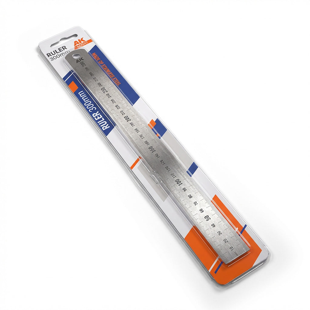 AK Interactive AK9547 Steel Ruler 300mm in retail blister packaging shown at angle with studio lighting highlighting stainless steel construction and metric scale