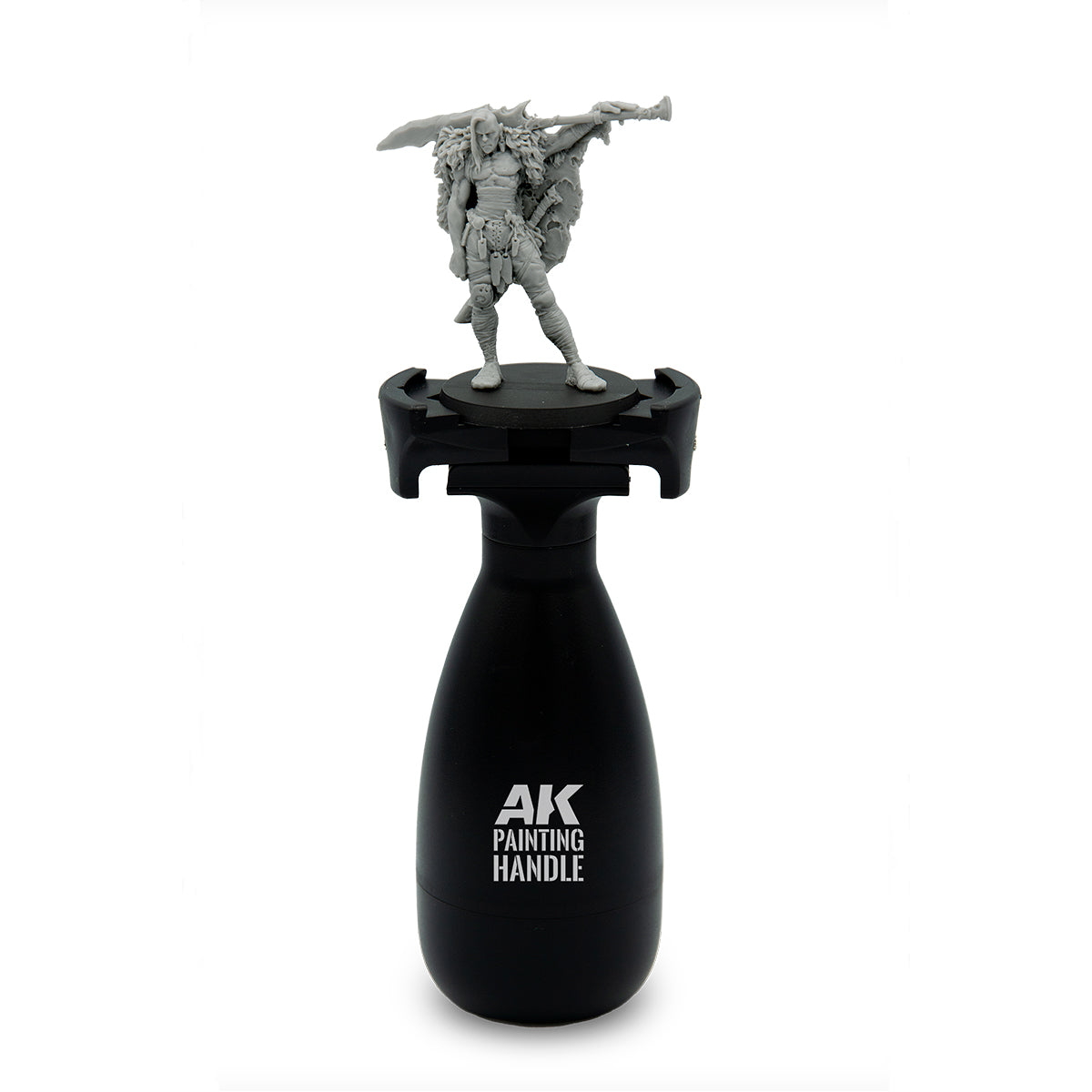 AK Interactive Painting Handle front view with unpainted fantasy warrior miniature mounted on top showing ergonomic black bottle-shaped grip body with AK Painting Handle branding