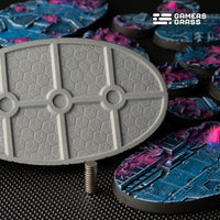 Close-up of 90mm oval Alien Infestation base showing extensive magnet slot system and mounting options

