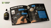 Close-up of the basing guide booklet from the Alien Grass Tuft Starter Box, showing example techniques for creating extraterrestrial landscapes
