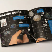 Close-up of the basing guide booklet from the Alien Grass Tuft Starter Box, showing example techniques for creating extraterrestrial landscapes