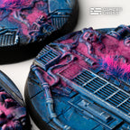 Close-up of a 60mm Alien Infestation base: pipework and grilles under magenta biomass beside a pink and blue tuft