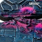 Macro of a 75mm Alien Infestation oval: a ribbed shape in the magenta growth beside two pink and blue tufts