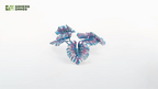 Close-up of assembled Gamers Grass Alien Monstera leaves in blue-teal tones showing laser-cut vein detail