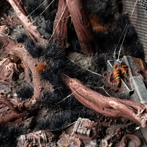 Eerie diorama featuring Alien Void 6mm - Wild tufts, showcasing a dark, foreboding landscape with shadowy vegetation perfect for sci-fi horror or dark fantasy scenes