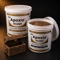 Aves Apoxie Sculpt 4lb Brown — large Part A and Part B tubs with brown putty visible, alongside a detailed sculpted miniature treasure chest with open lid and wood-grain texture
