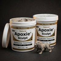Aves Studio Apoxie Sculpt Natural 4 lb with Part A and Part B tubs beside a natural sculpted lion figure
