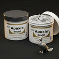 Aves Studio Apoxie Sculpt Silver Grey 1 lb with Part A and Part B jars beside a silver bird sculpture