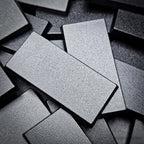Close-up of base corner showing 1.5mm wall thickness and glossy black finish