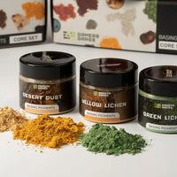 A selection of 3 different colored dry pigments for basing and weathering miniatures.