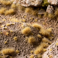 Arid landscape diorama featuring Beige 6mm Small Tufts, showcasing realistic dry vegetation in a desert or steppe scene with miniature figures
