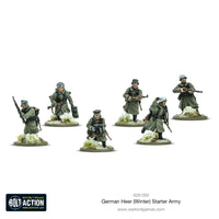 Fully painted winter infantry miniatures from the Bolt Action German Heer Winter Starter Army, showcasing WWII soldiers in action poses.
