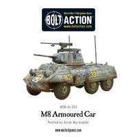 Painted M8 Greyhound Scout Car in action during Bolt Action WWII game
