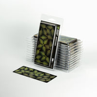 Set of 22 laser-cut Bracken fern leaves, showcasing various sizes and green shades in protective packaging
