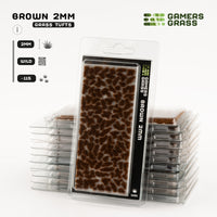 Gamers Grass Brown 2mm Tufts packaging, featuring autumnal prairie imagery and hints of alien landscapes
