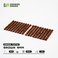 Sheet of 70 Brown 4mm - Small Tufts, displaying various shapes and sizes of reddish-brown grass tufts ready for dry terrain application
