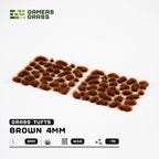 Sheet of 70 Brown 4mm - Wild Tufts, displaying various shapes and sizes of reddish-brown grass tufts ready for dry terrain applications