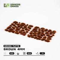 Sheet of 70 Brown 4mm - Wild Tufts, displaying various shapes and sizes of reddish-brown grass tufts ready for dry terrain applications
