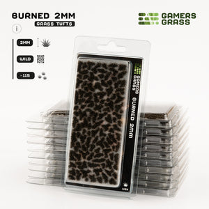 Gamers Grass Burned 2mm Tufts packaging, featuring dark, desolate landscape imagery that sets a somber mood