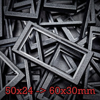Close-up of 50x24mm to 60x30mm base converter – textured ABS plastic for wargaming