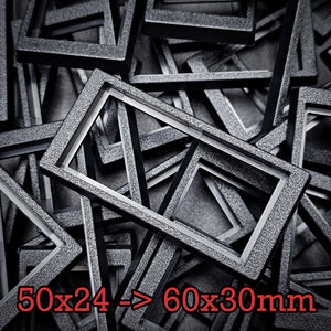 Close-up of 50x24mm to 60x30mm base converter – textured ABS plastic for wargaming