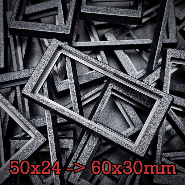 Close-up of 50x24mm to 60x30mm base converter – textured ABS plastic for wargaming