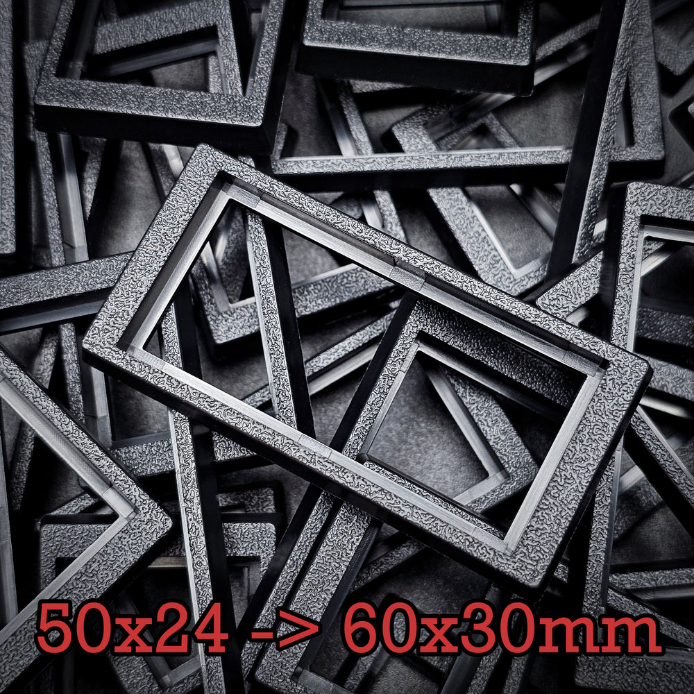 Close-up of 50x24mm to 60x30mm base converter – textured ABS plastic for wargaming