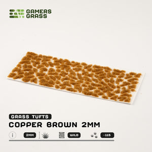 Sheet of 115 Copper Brown 2mm tufts, displaying various shapes and sizes of realistic, light copper-toned grass ready for application