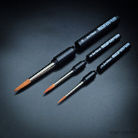 da Vinci Cosmotop-Spin travel brushes with protective handle caps removed to show compact design
