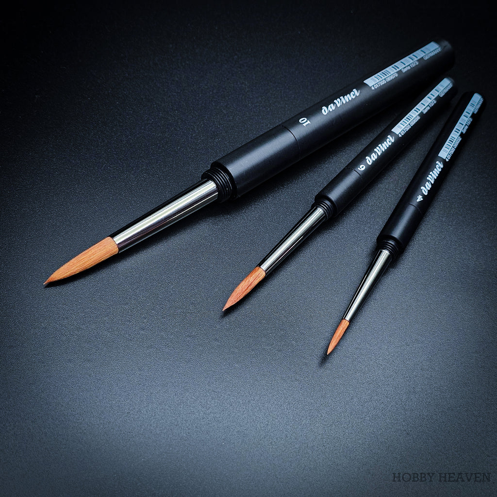 Three da Vinci Cosmotop-Spin travel round brushes assembled with black screw-together handles