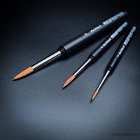 Three da Vinci Cosmotop-Spin travel round brushes assembled with black screw-together handles
