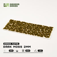 Sheet of 115 Dark Moss 2mm tufts, showcasing various shapes and sizes of realistic, deep green moss ready for application
