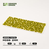 Sheet of 115 Dark Moss 2mm tufts, showcasing various shapes and sizes of realistic, deep green moss ready for application
