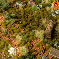 Realistic meadow diorama featuring Dry Green 2mm Tufts, showcasing a lifelike grassland scene amid the short, lush vegetation
